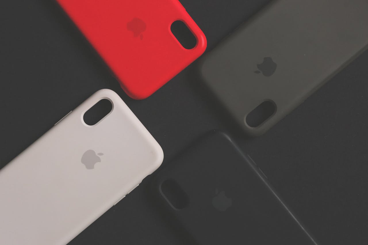 Mastering the First Impression: Your intriguing post title goes here Four colorful smartphone cases on a dark surface, showcasing variety and design.