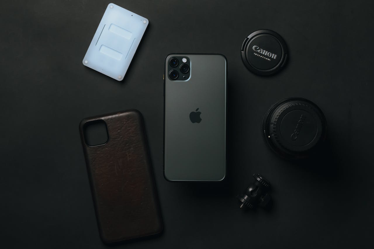 The Art of Drawing Readers In: Your attractive post title goes here From above of expensive smartphone placed near camera lens and phone case on dark table